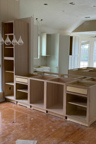 Installation begins with cabinets for The Hills Kitchen Remodel