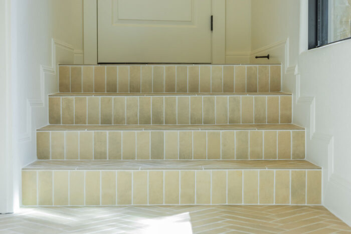 Austin Home Remodel with Stair Tile in Herringbone Pattern